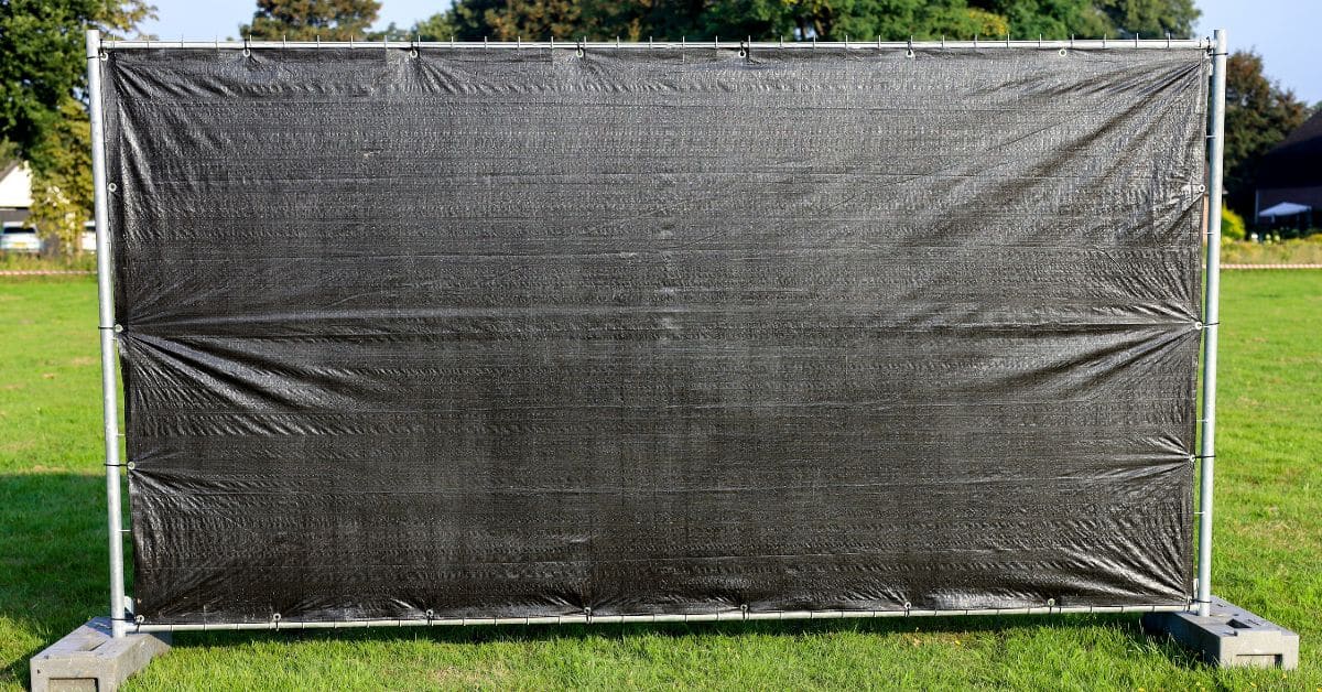 Windscreens vs. Slats: Exploring Chain Link Fence Covers